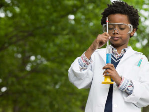 A boy doing an experiment