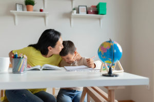 live-in homeschool teacher teaching child