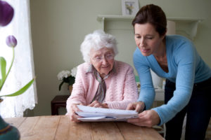 in home caregiver with elderly woman