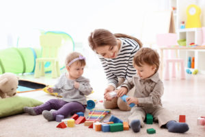 nanny playing with children